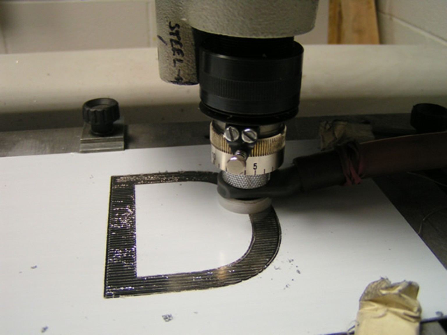 Engraving equipment producing lettering
